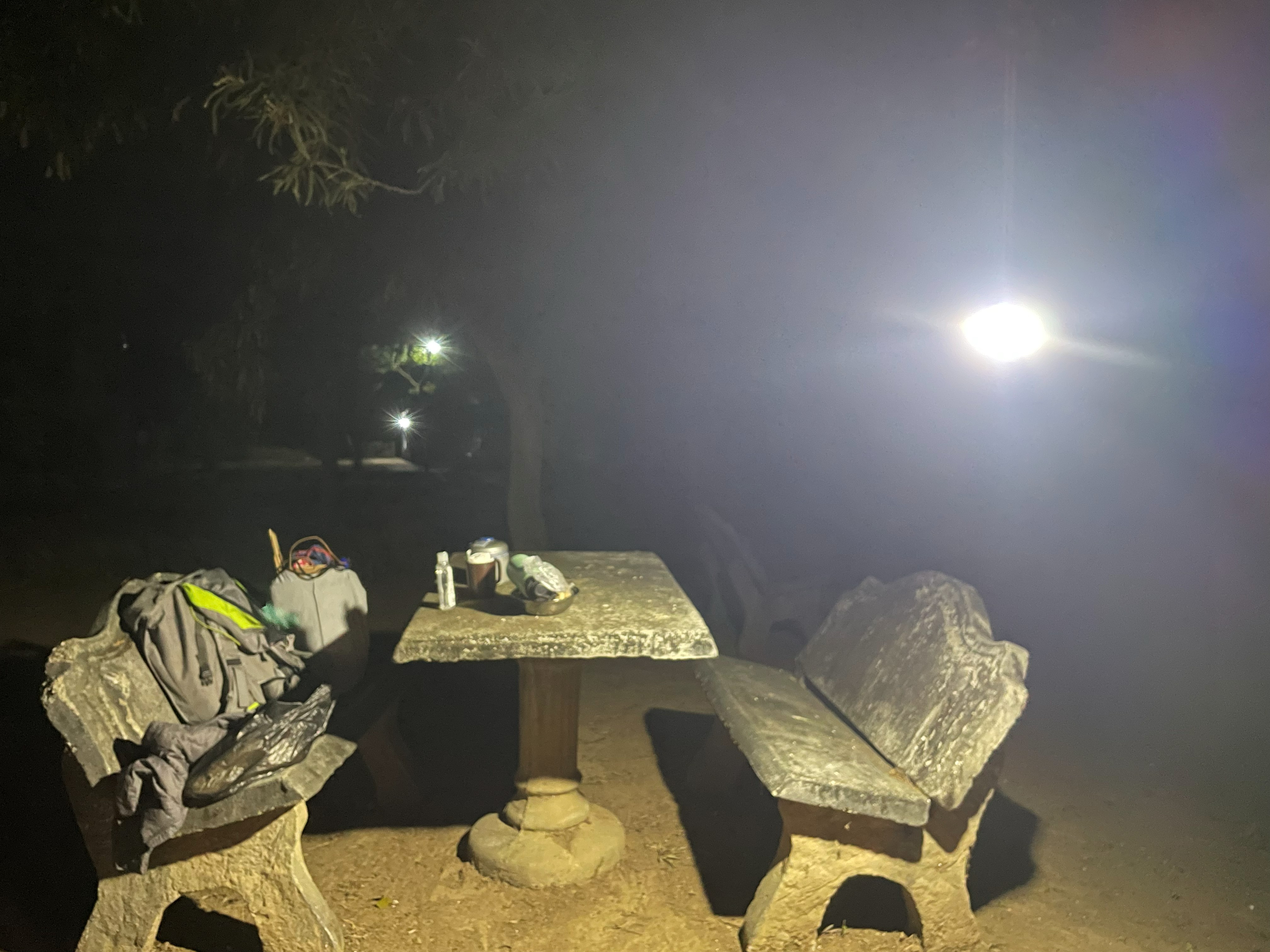 A table lit by lantern light after dark